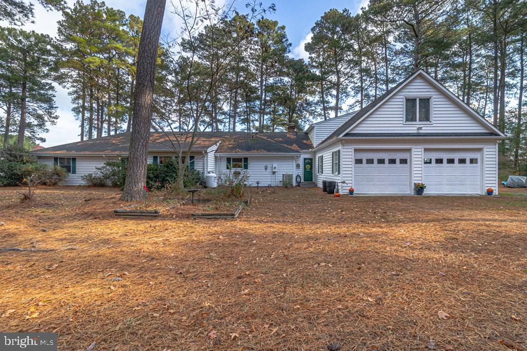 405 Courtney Lane Callao, VA 22435 - Photo 57 of 60 a front view of a house with a yard and garage