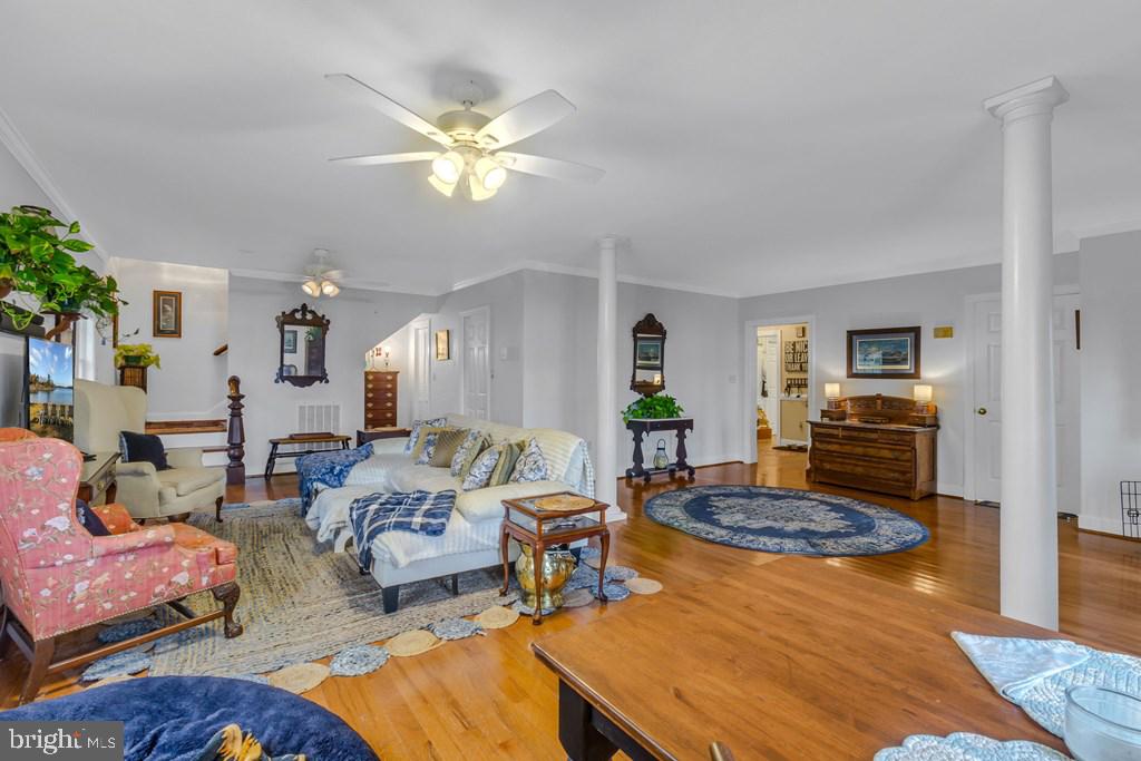 405 Courtney Lane Callao, VA 22435 - Photo 7 of 60 a living room with furniture and a chandelier