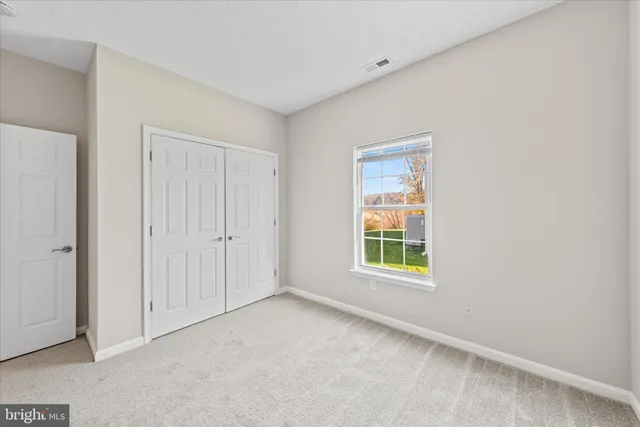 a view of lake with green space