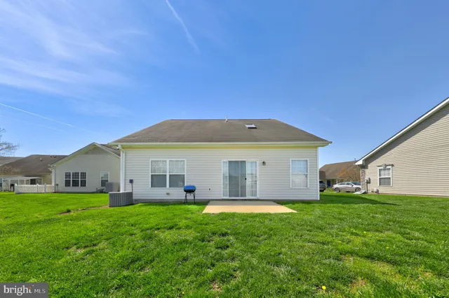 an aerial view of a house with outdoor space swimming pool and lake view
