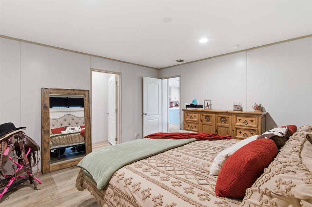 8792 Highway 67 Saltillo, TX 75478 - Photo 20 of 40 a bedroom with a bed and a closet