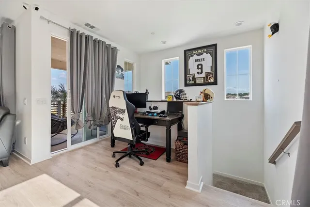 a bedroom with a large bed and a dresser