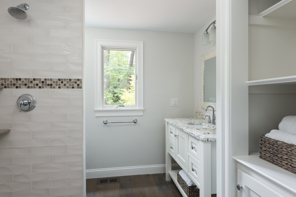148 Paddock Circle Mashpee, MA 02649 - Photo 13 of 28 a bathroom with a sink a toilet and vanity