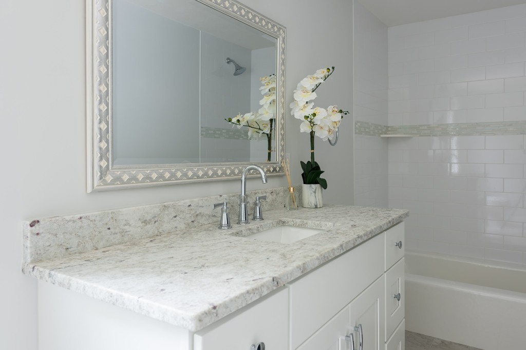148 Paddock Circle Mashpee, MA 02649 - Photo 17 of 28 a bathroom with a sink and a mirror