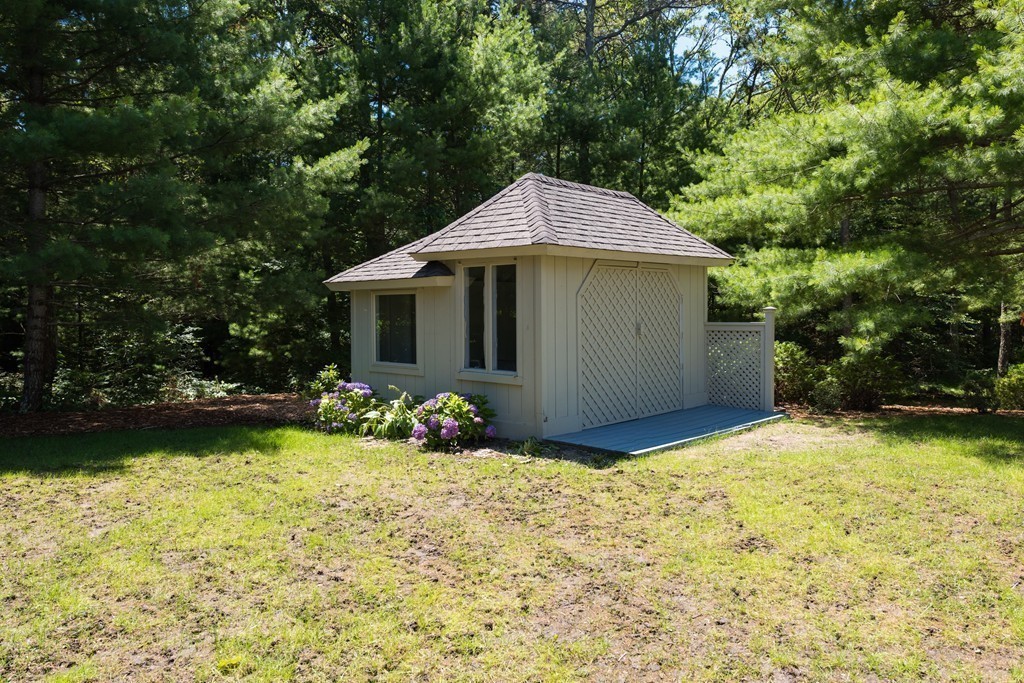 148 Paddock Circle Mashpee, MA 02649 - Photo 22 of 28 a front view of a house with garden