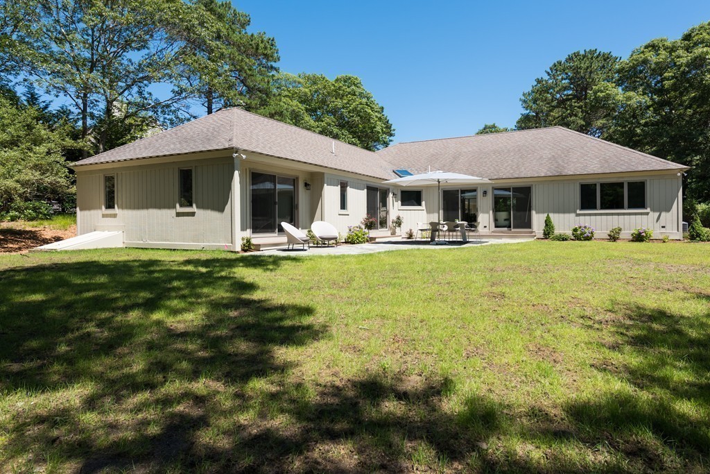 148 Paddock Circle Mashpee, MA 02649 - Photo 24 of 28 a front view of a house with garden