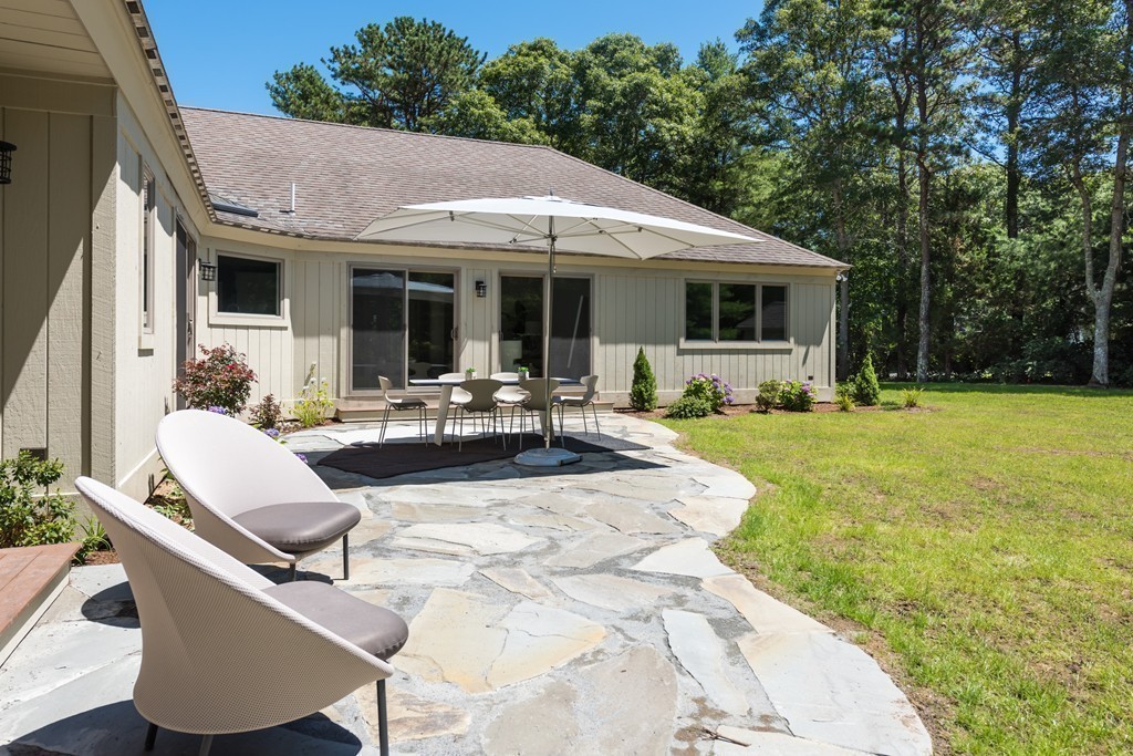 148 Paddock Circle Mashpee, MA 02649 - Photo 25 of 28 a view of outdoor space yard deck patio and fire pit