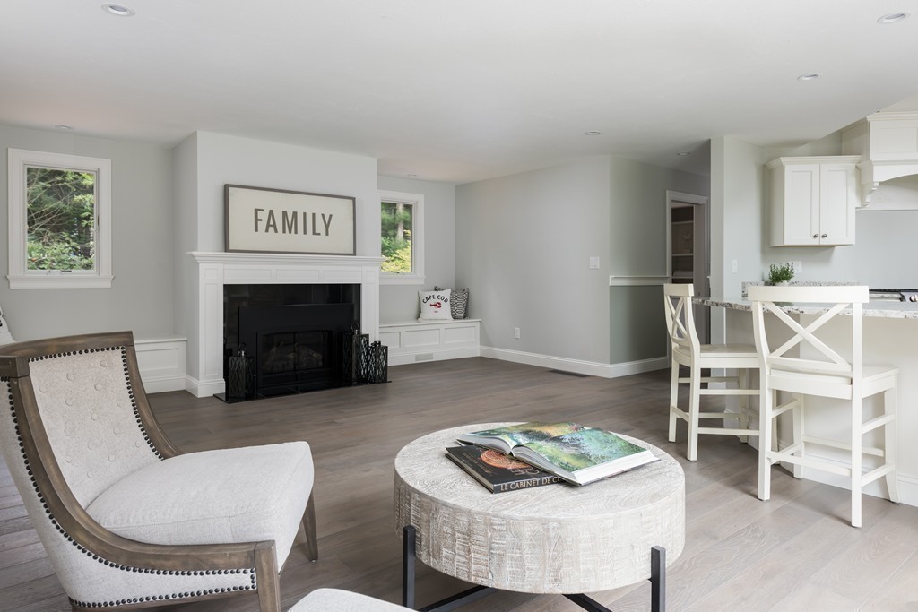 148 Paddock Circle Mashpee, MA 02649 - Photo 6 of 28 a living room with furniture and a fireplace