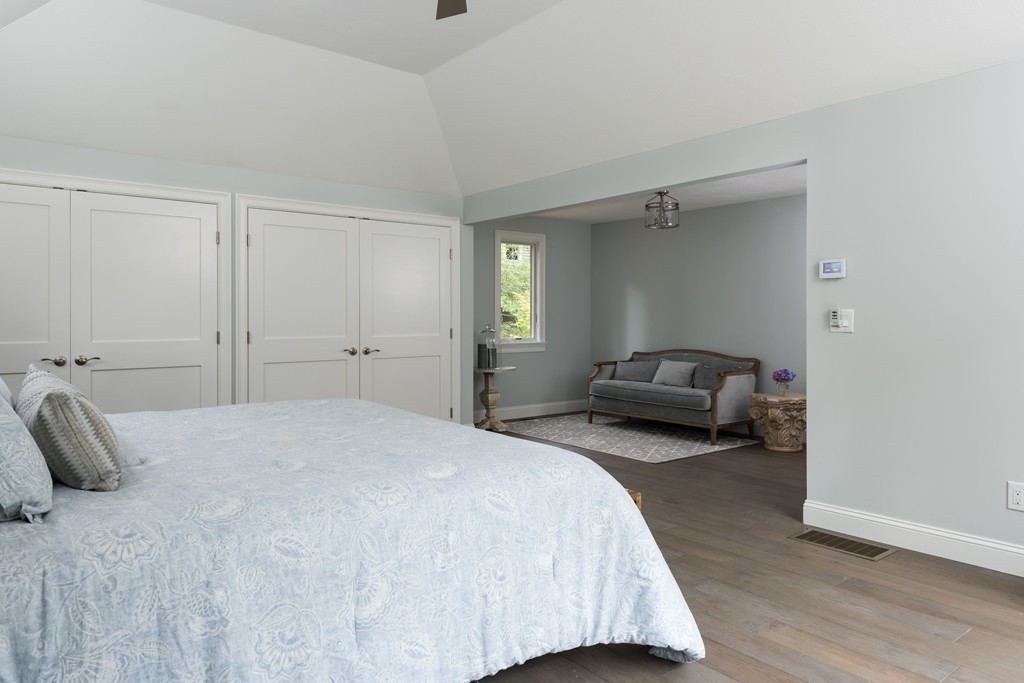 148 Paddock Circle Mashpee, MA 02649 - Photo 9 of 28 a bedroom with a bed and a large window