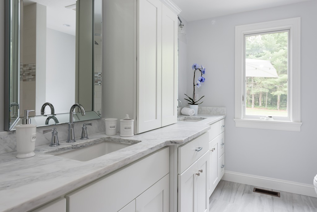148 Paddock Circle Mashpee, MA 02649 - Photo 10 of 28 a bathroom with a sink and a mirror