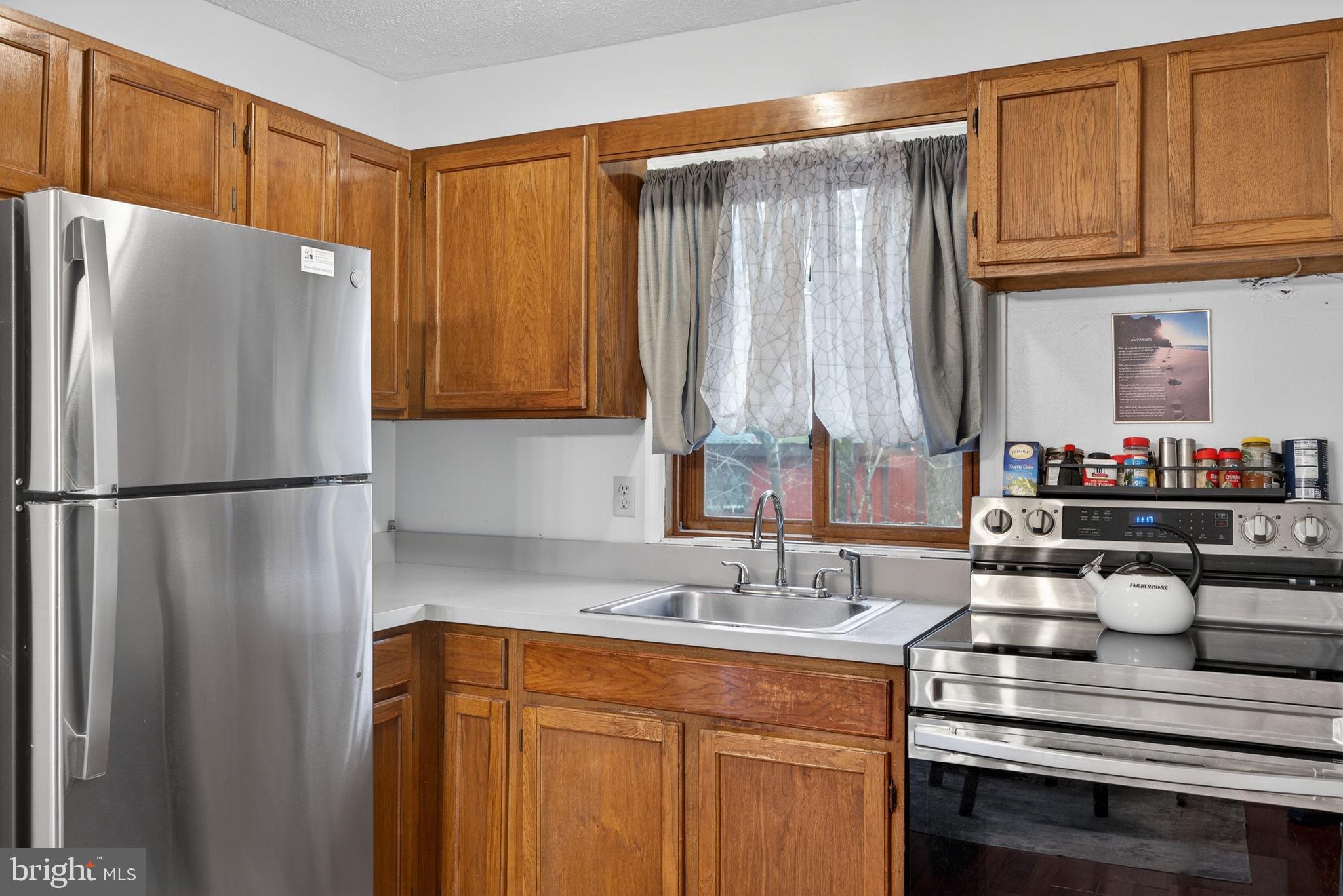 244 Canterbury Road Bushkill, PA 18324 - Photo 30 of 45 Charming kitchen with warm wooden accents.