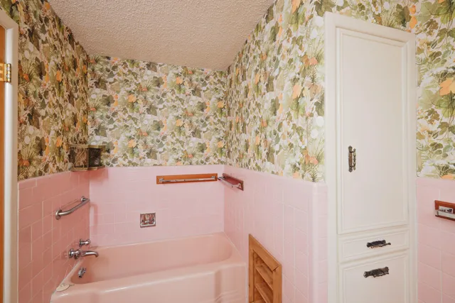 a bathroom with a bathtub and shower