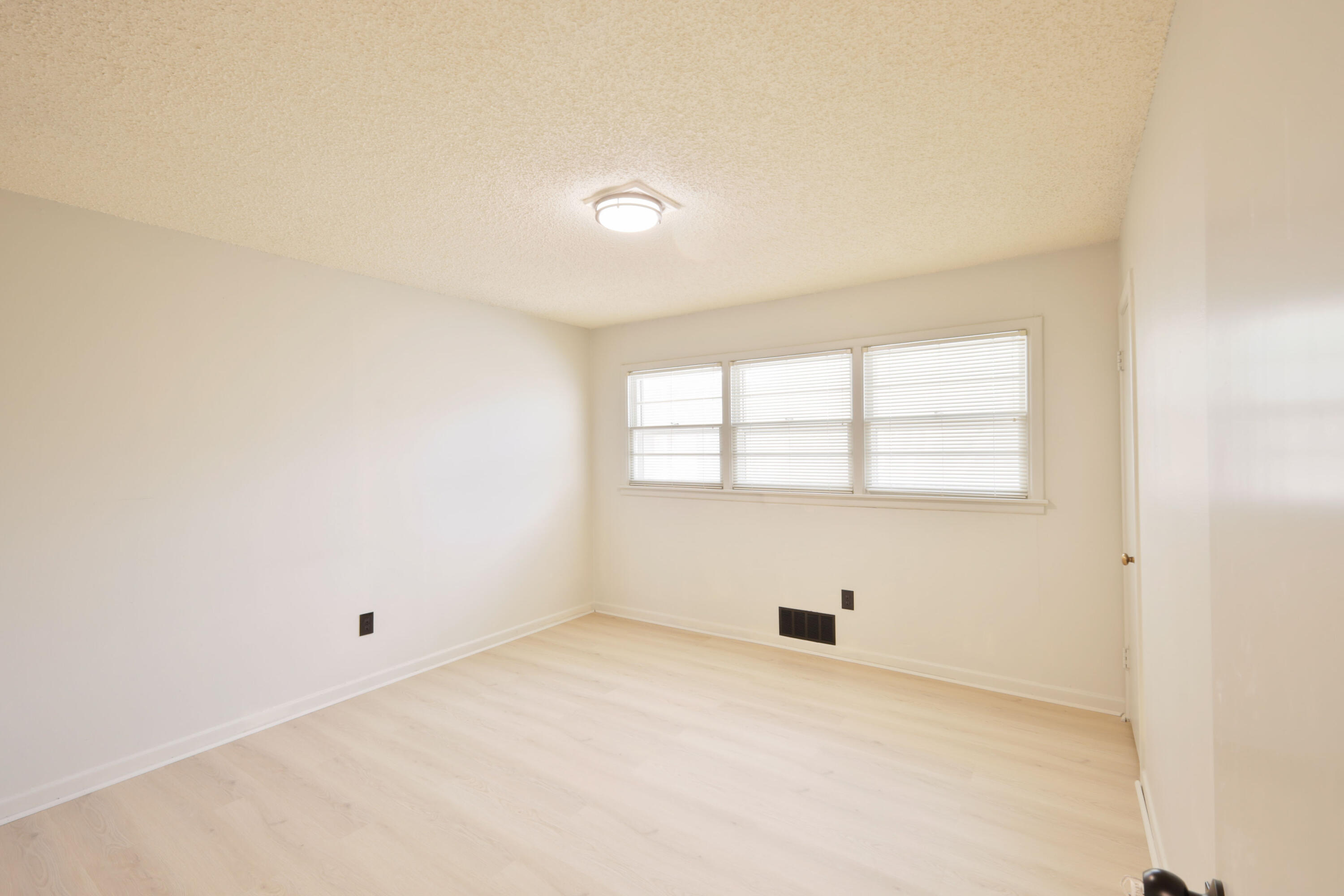 3202 45th Street Lubbock, TX 79413 - Photo 14 of 20 an empty room with windows