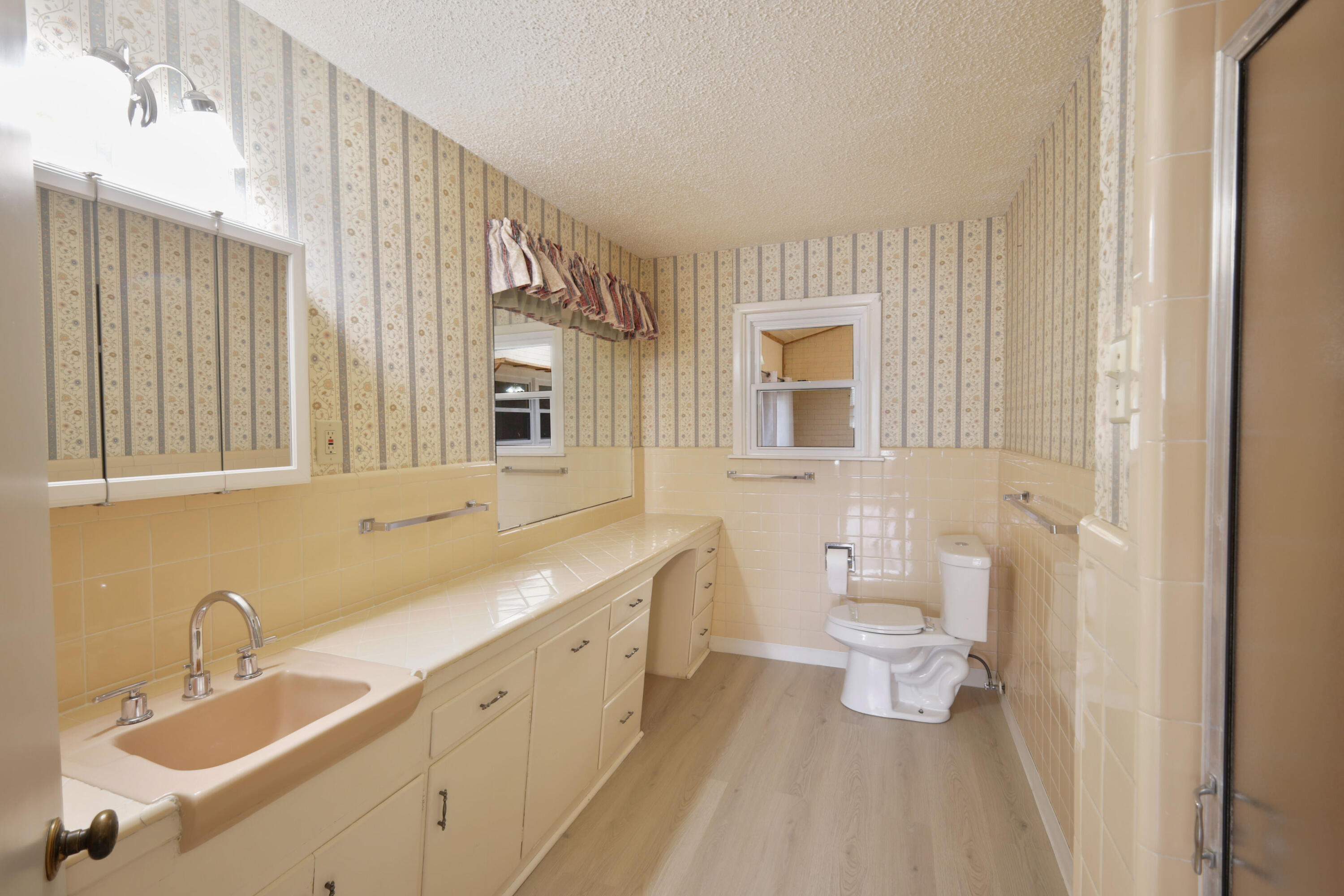 3202 45th Street Lubbock, TX 79413 - Photo 18 of 20 a bathroom with a double vanity sink mirror and toilet