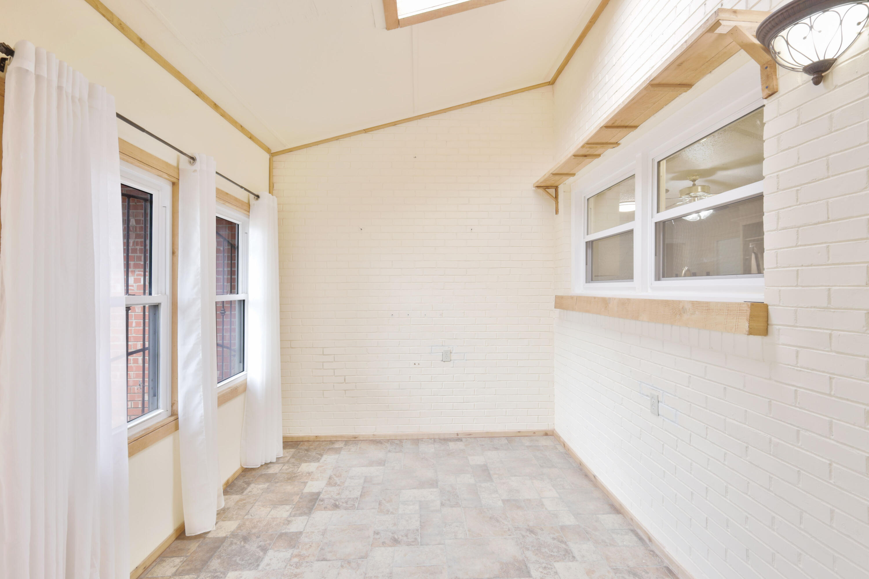 3202 45th Street Lubbock, TX 79413 - Photo 4 of 20 a view of an empty room with a window
