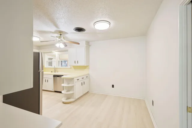 a bathroom with a sink vanity and a mirror