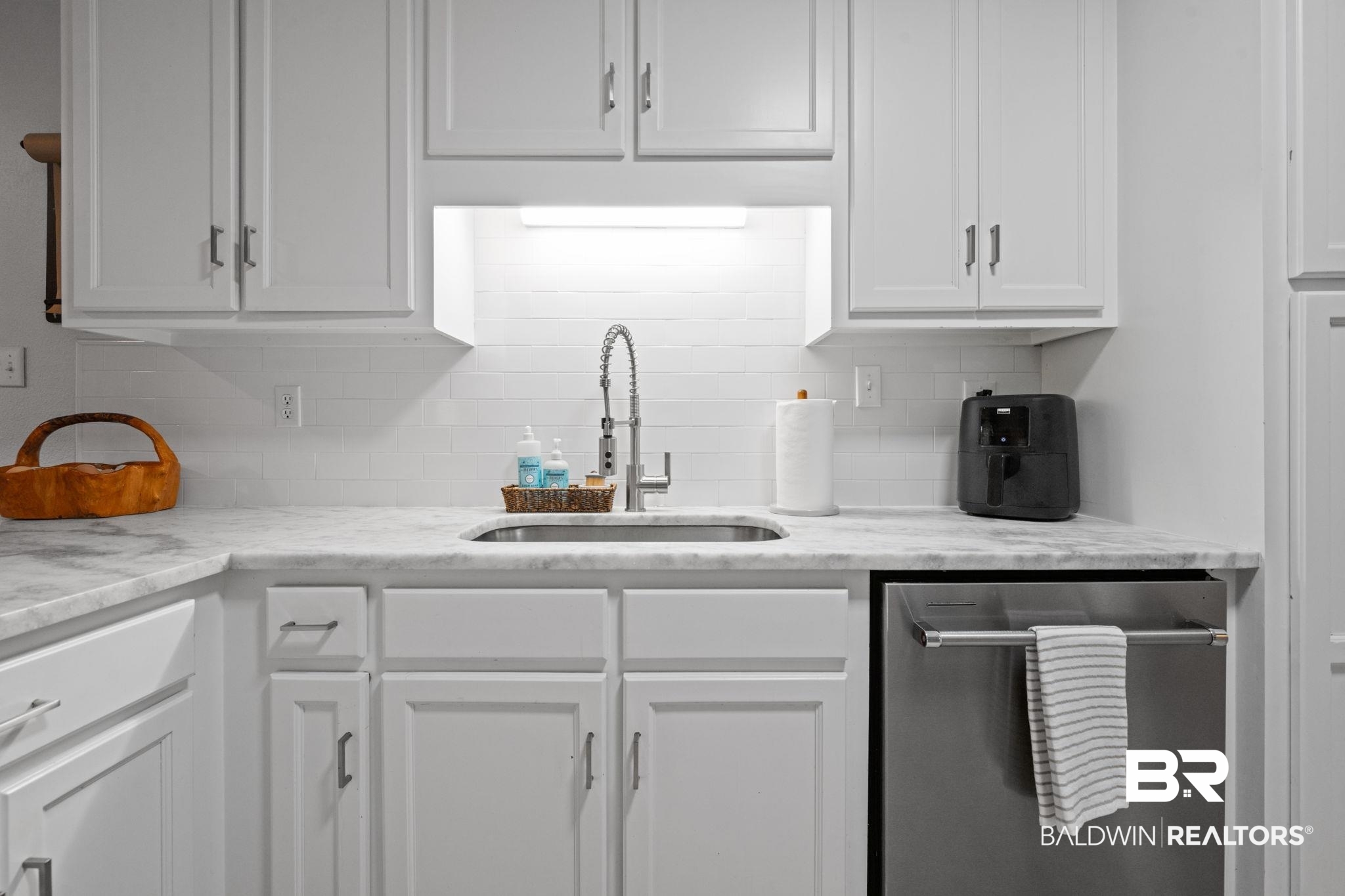 5936 Lundy Road Theodore, AL 36582 - Photo 8 of 32 Kitchen featuring white shaker-style cabinetry, a stainless steel sink, a pull-down faucet, light-toned countertops, and a white subway tile backsplash