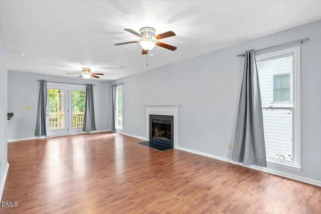a view of an entryway with wooden floor and door