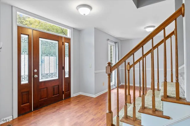 a view of an entryway with a floor to ceiling window