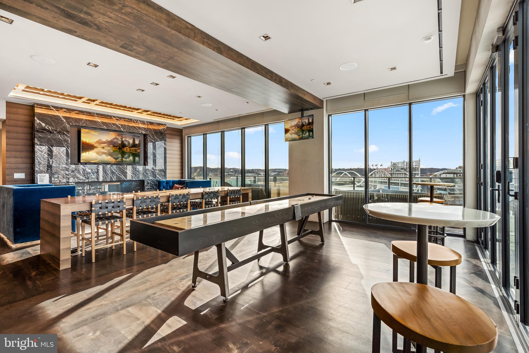 70 N Street Southeast, Unit N815 Washington, DC 20003 - Photo 14 of 27 a room with lots of tables a large window and chairs