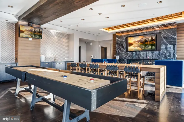 a room with table tennis and air hockey table