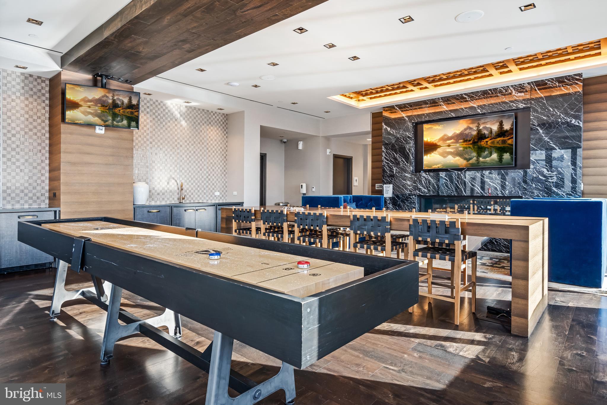 70 N Street Southeast, Unit N815 Washington, DC 20003 - Photo 15 of 27 a room with table tennis and air hockey table