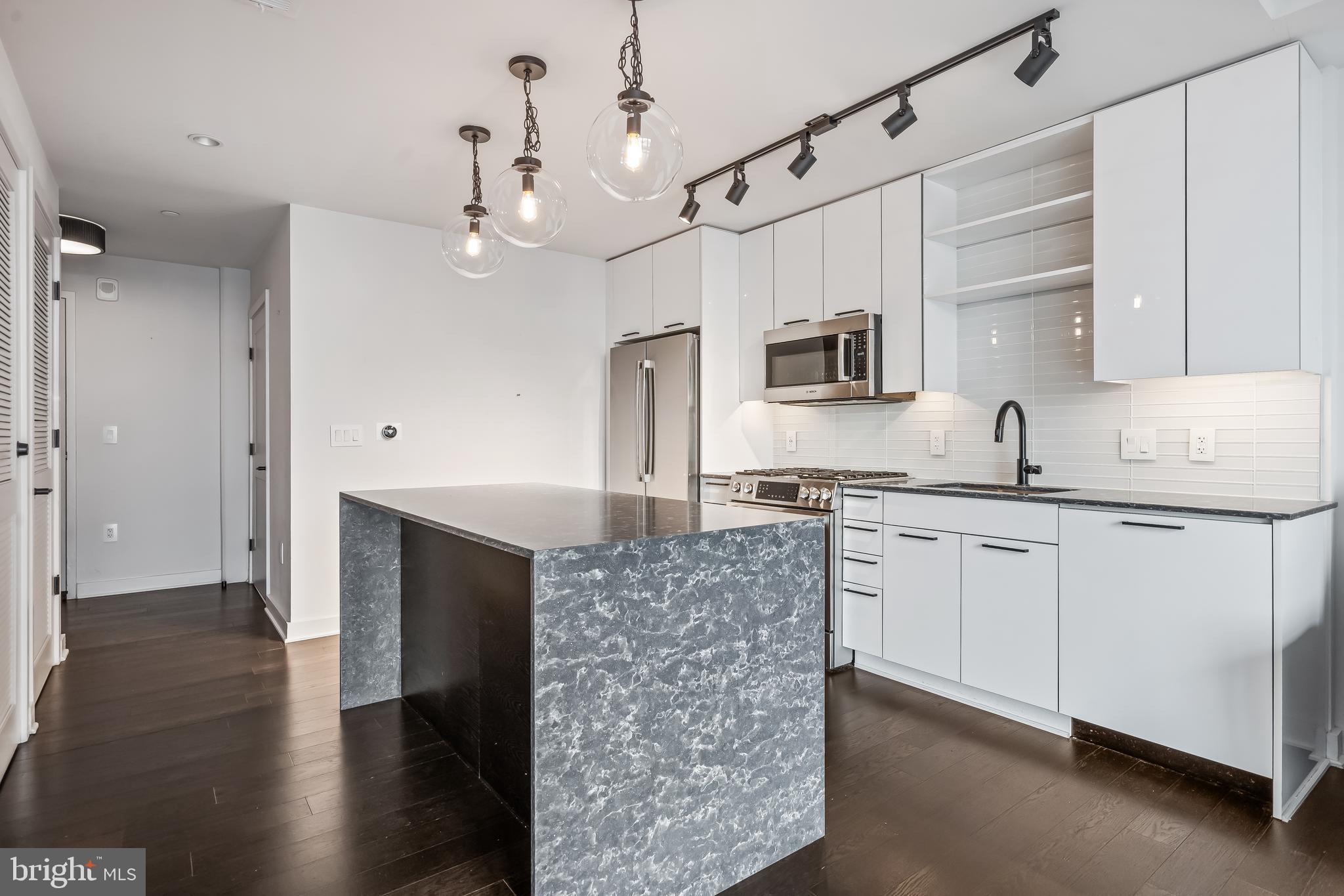 70 N Street Southeast, Unit N815 Washington, DC 20003 - Photo 4 of 27 a kitchen with a sink stove and refrigerator