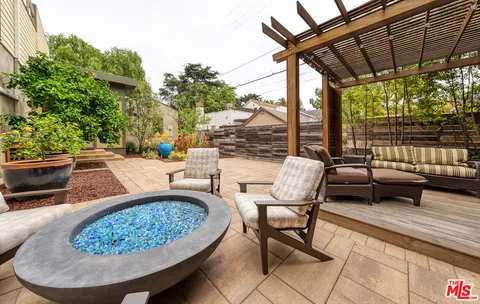 a view of a chairs and tables in the patio
