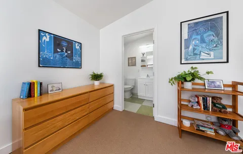 a room with furniture and baby crib