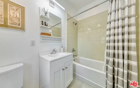 a bathroom with a sink a toilet and a bathtub