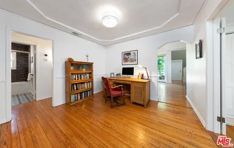 a room with furniture and a wooden floor