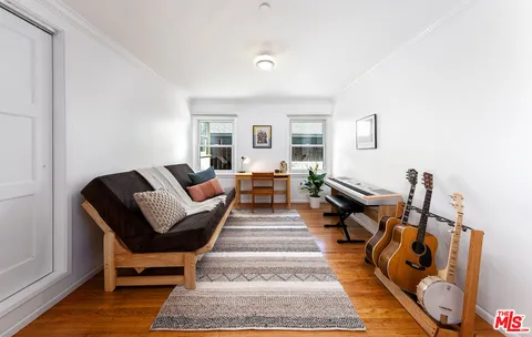 a living room with furniture and a rug
