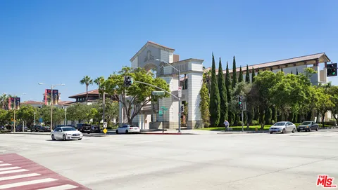 a view of a street with a building in the background