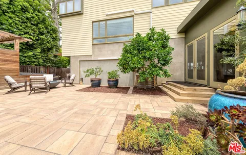 a view of a backyard with sitting area