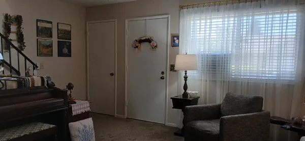 a living room with furniture and a window
