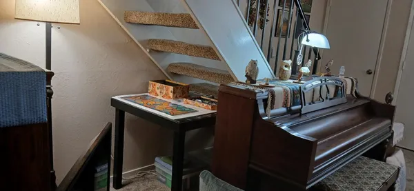 a view of an entryway with wooden floor
