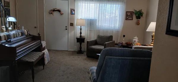 a living room with furniture and a window