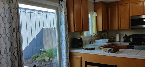 a kitchen with a sink cabinets and appliances