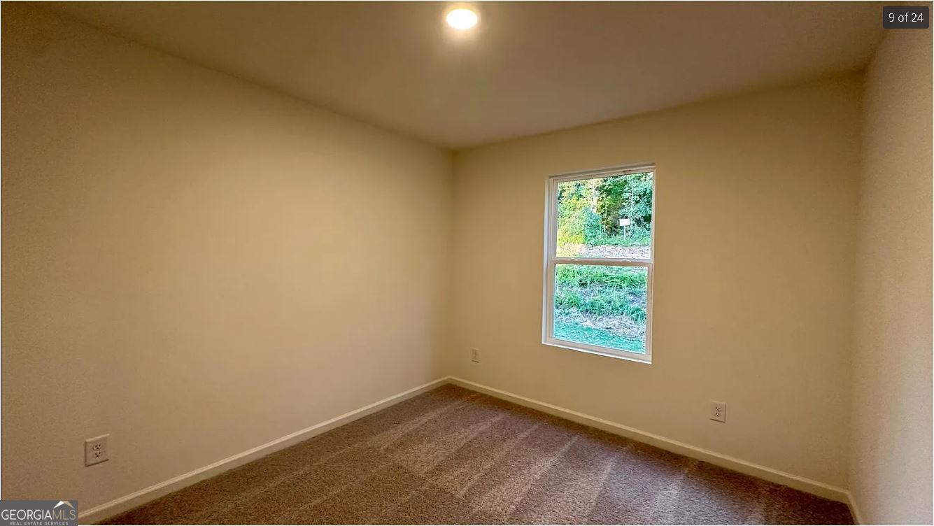 486 Grand Magnolia Street Jackson, GA 30233 - Photo 16 of 24 an empty room with window