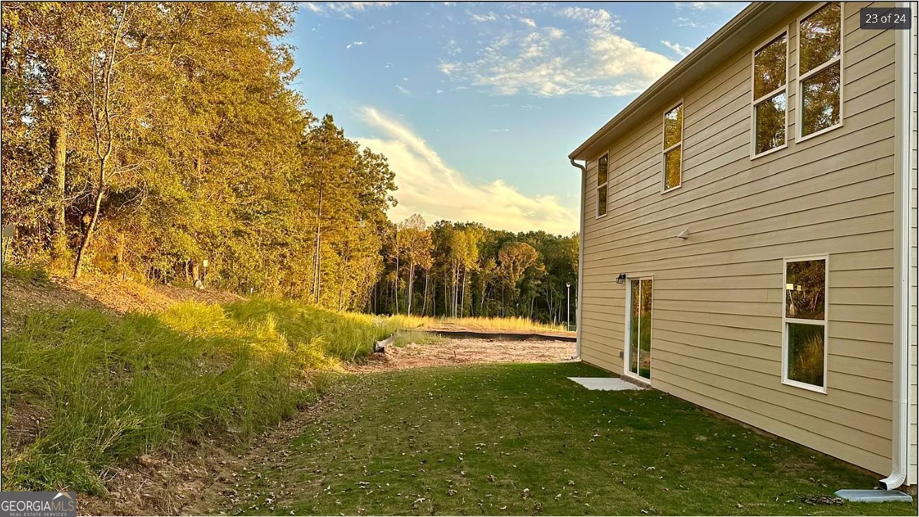 486 Grand Magnolia Street Jackson, GA 30233 - Photo 2 of 24 a view of a backyard