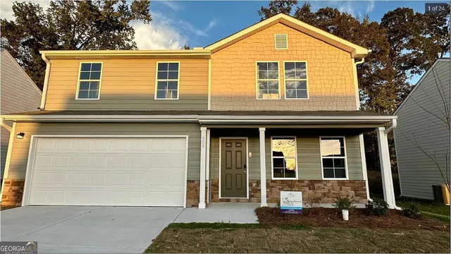 a view of a brick house with large windows