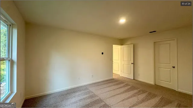 a view of an empty room and window