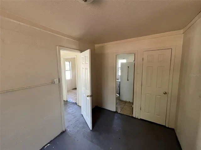 a view of a room with wooden floor