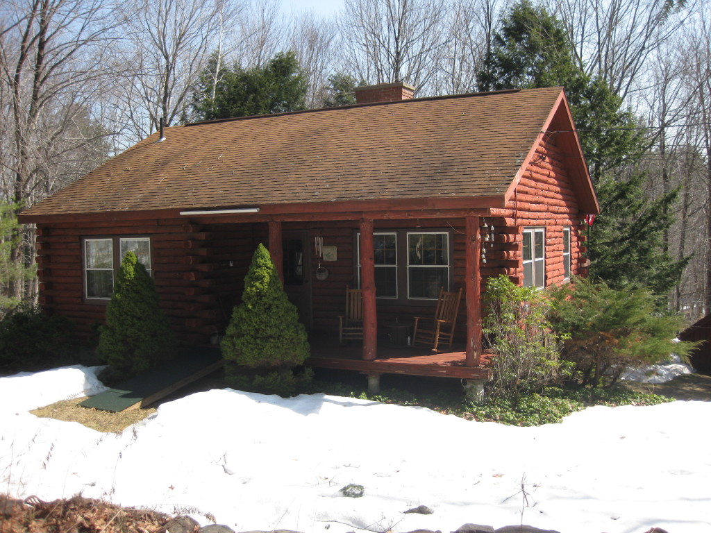162 Chipman Road Middlefield, MA 01011 - Photo 1 of 11 a front view of a house with a yard