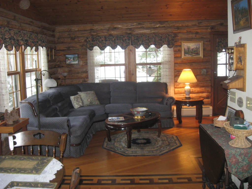 162 Chipman Road Middlefield, MA 01011 - Photo 5 of 11 a living room with furniture and a chandelier