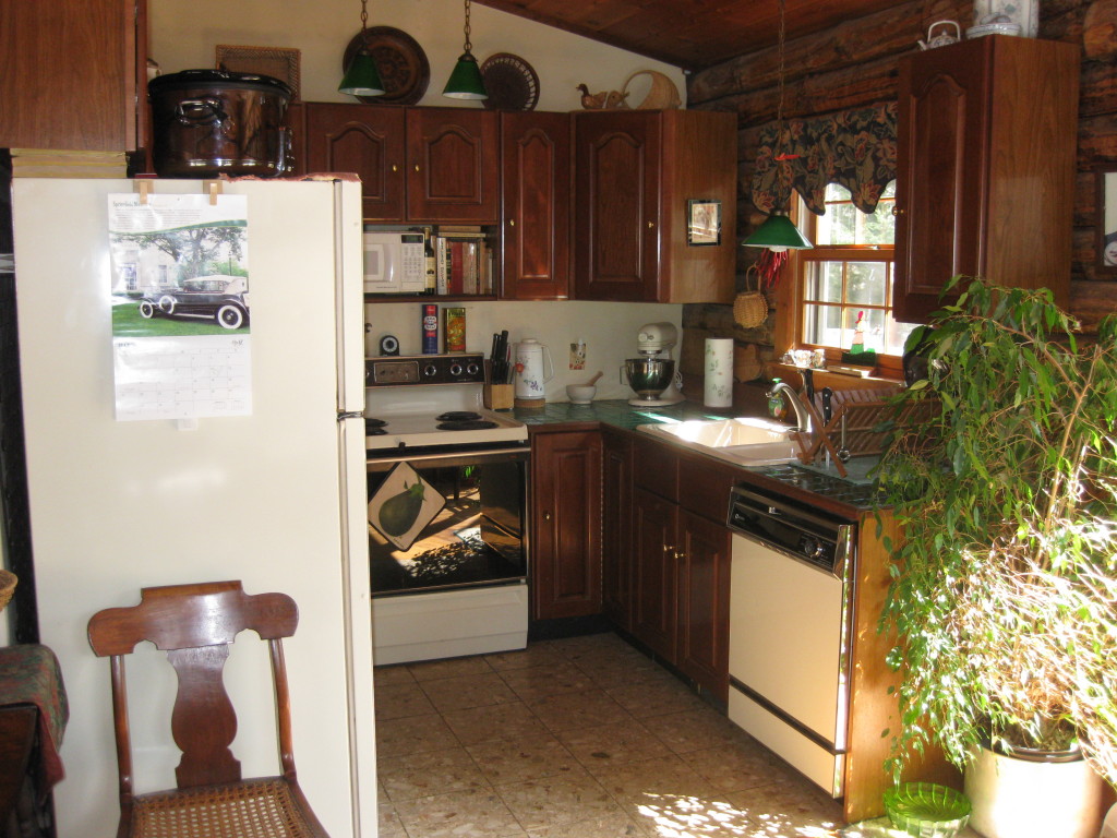 162 Chipman Road Middlefield, MA 01011 - Photo 7 of 11 a kitchen with stainless steel appliances granite countertop a refrigerator and a stove