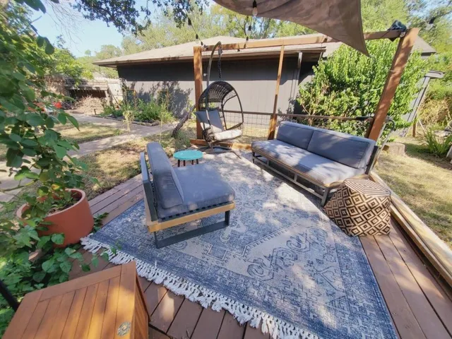 swimming pool view with a seating space