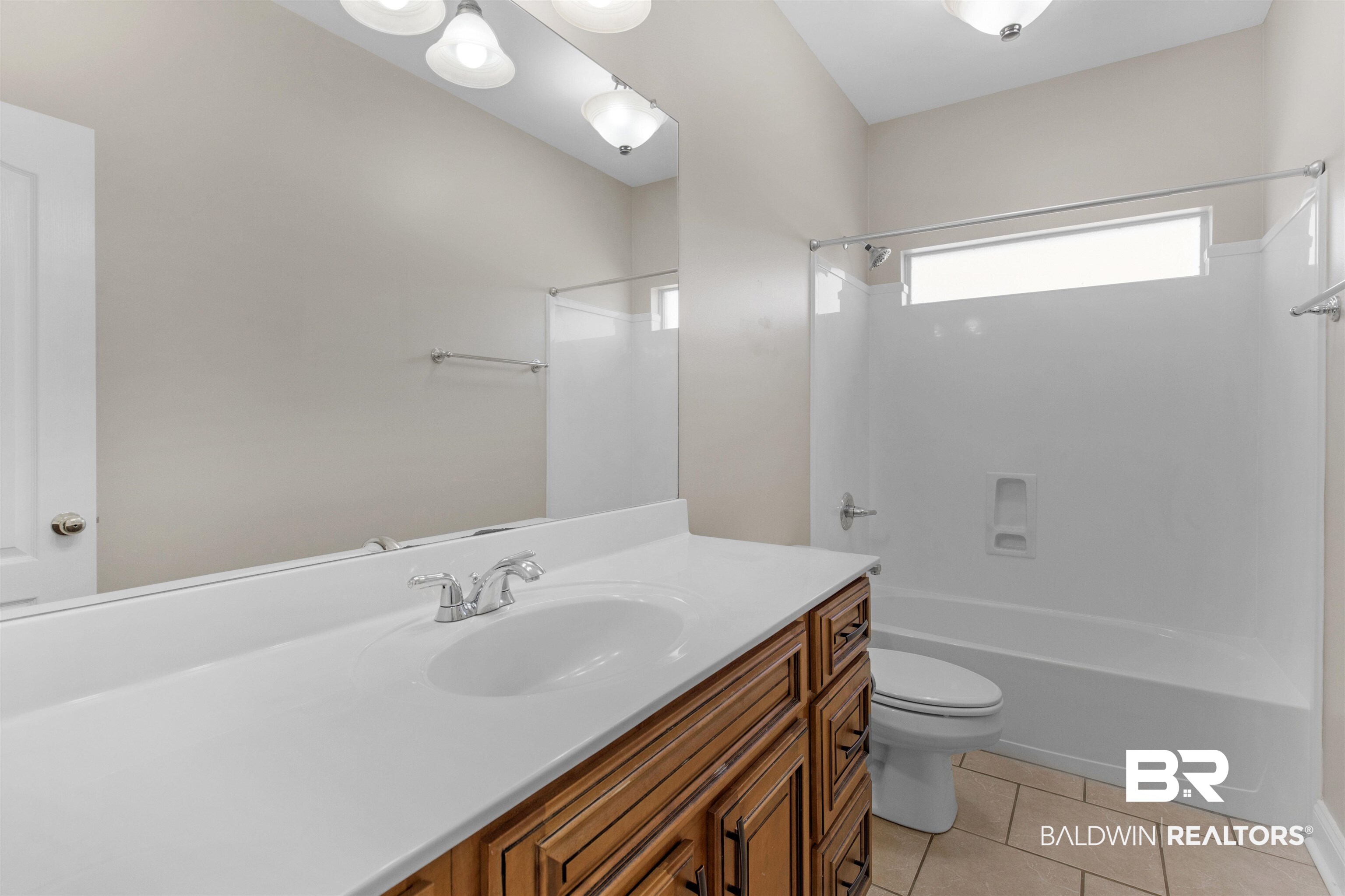 330 Allison Court Mobile, AL 36608 - Photo 17 of 27 Full bathroom with tile patterned flooring, shower / bath combination, vanity, and toilet
