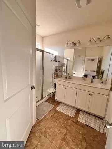 a kitchen with a sink and refrigerator