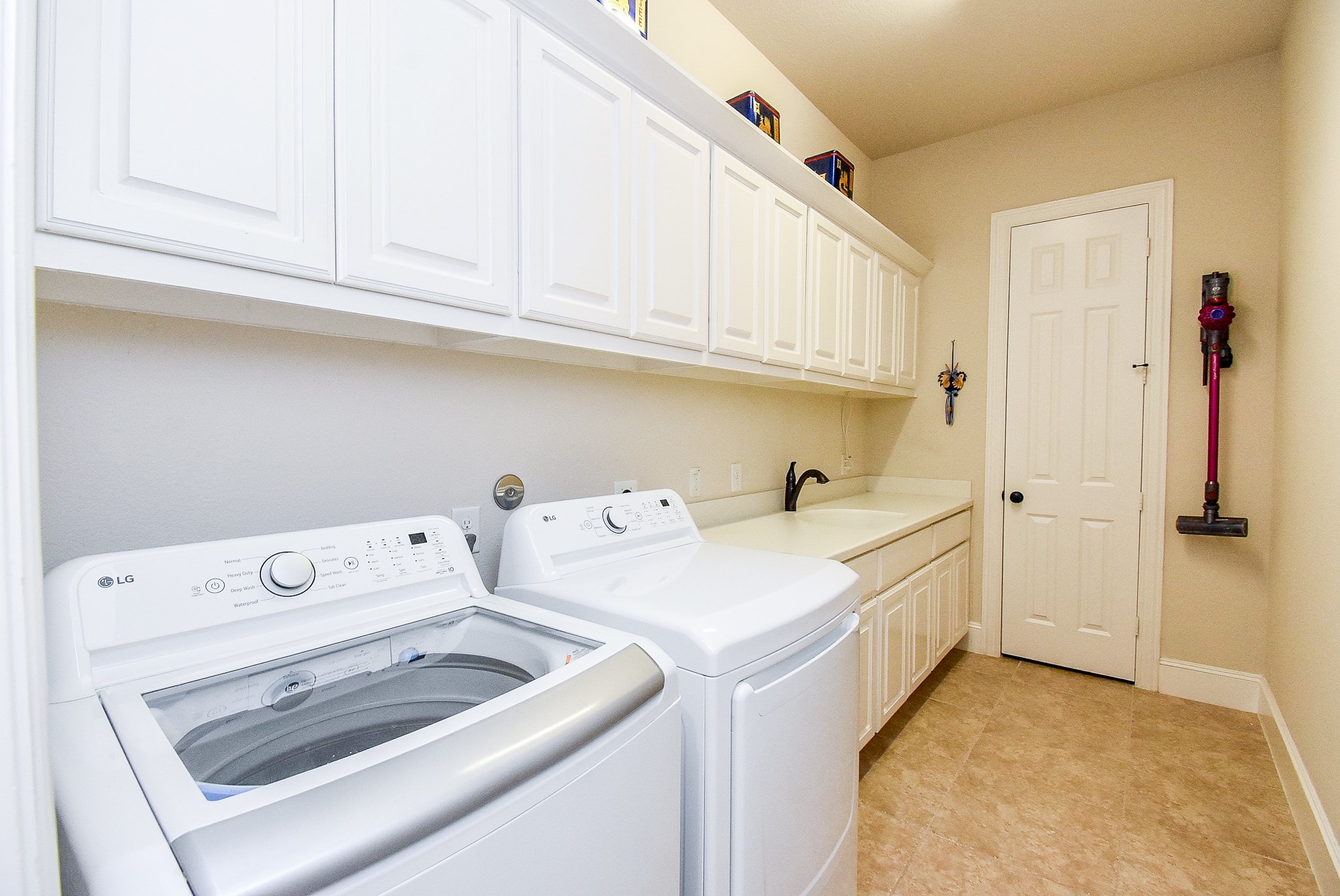 27427 Guthrie Ridge Lane Katy, TX 77494 - Photo 42 of 48 a view of storage and utility room with washer and dryer